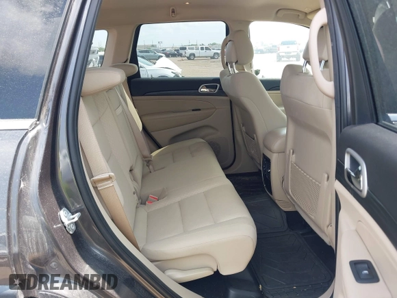 2020 Jeep Grand Cherokee Laredo E with VIN 1C4RJEAG2LC284912, listed as a IAAI auction lot 42114881 with 86,579 mi miles and . Bid and sale history available at DreamBid. Image 8.