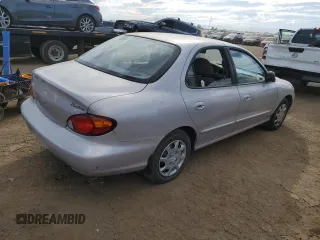 1999 Hyundai Elantra z VIN KMHJF25F8XU852123, wystawiony jako Copart lot #72284584 z przebiegiem 12 750 mil mil oraz Czysty tytuł • Clean title. Historia ofert i sprzedaży dostępna na DreamBid. Obrazek 3.