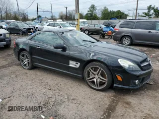 2009 Mercedes-Benz SL 55/63 AMG with VIN WDBSK70F79F157839, listed as a Copart auction lot 52350295 with 79,670 mi miles and Salvage title. Bid and sale history available at DreamBid. Image 4.