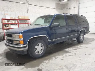 1999 Chevrolet Suburban with VIN 3GNEC16RXXG237570, listed as a IAAI auction lot 40210234 with 176,902 mi miles. Bid and sale history available at carsss.com. Image 2.