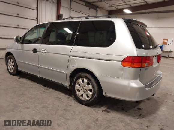 2004 Honda Odyssey EX-L with VIN 5FNRL18974B127696, listed as a IAAI auction lot 41643243 with 200,286 mi miles and . Bid and sale history available at DreamBid. Image 3.