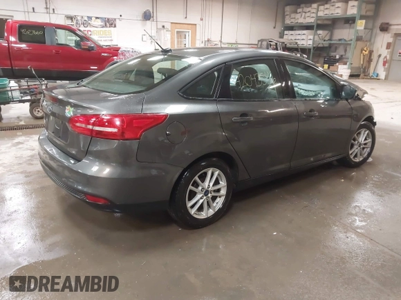 2016 Ford Focus SE with VIN 1FADP3F21GL247906, listed as a IAAI auction lot 42043546 with 124,532 mi miles and . Bid and sale history available at DreamBid. Image 4.