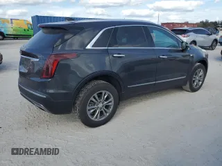 2023 Cadillac XT5 AWD Premium Luxury with VIN 1GYKNDR4XPZ153623, listed as a Copart auction lot 77071324 with 26,292 mi miles and Non Repairable. Bid and sale history available at DreamBid. Image 3.