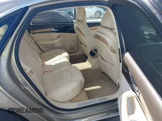 2012 Audi A8 z VIN WAURVAFD0CN001646, wystawiony jako IAAI lot #41524110 z przebiegiem 105 187 mil mil oraz . Historia ofert i sprzedaży dostępna na DreamBid. Obrazek 8.