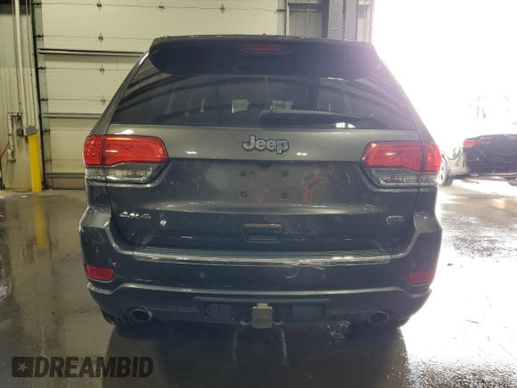 2016 Jeep Grand Cherokee Overland with VIN 1C4RJFCG9GC345309, listed as a Copart auction lot 61095285 with 115,968 mi miles and Salvage title. Bid and sale history available at DreamBid. Image 6.