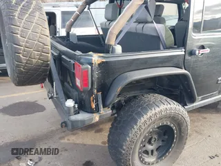 2009 Jeep Wrangler Unlimited Rubicon z VIN 1J4GA69159L749215, wystawiony jako IAAI lot #41489893 z przebiegiem 177 768 mil mil oraz . Historia ofert i sprzedaży dostępna na DreamBid. Obrazek 18.