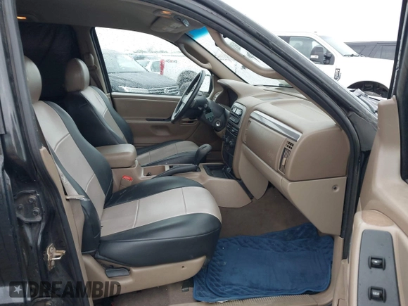 2004 Jeep Grand Cherokee Laredo with VIN 1J4GW48S74C390569, listed as a IAAI auction lot 42384503 with 191,530 mi miles and . Bid and sale history available at DreamBid. Image 5.