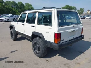 1996 Jeep Cherokee Sport z VIN 1J4FJ68S3TL226188, wystawiony jako IAAI lot #42460538 z przebiegiem 217 118 mil mil oraz . Historia ofert i sprzedaży dostępna na DreamBid. Obrazek 3.