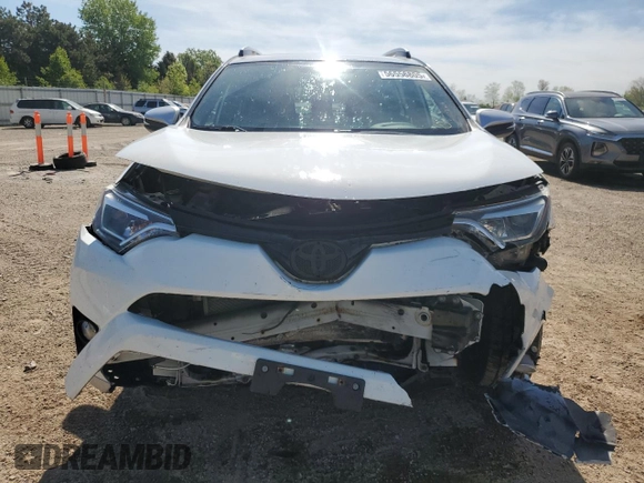 2016 Toyota RAV4 SE with VIN JTMJFREV3GJ054196, listed as a Copart auction lot 56556805 with 130,104 mi miles and Salvage title. Bid and sale history available at DreamBid. Image 5.