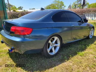 2012 BMW 3 Series 335i with VIN WBAKG7C51CE802713, listed as a IAAI auction lot 42032267 with 124,349 mi miles. Bid and sale history available at carsss.com. Image 4.