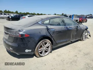 2013 Tesla Model S with VIN 5YJSA1AC9DFP10400, listed as a Copart auction lot 64096555 with 165,166 mi miles and Salvage title. Bid and sale history available at DreamBid. Image 3.