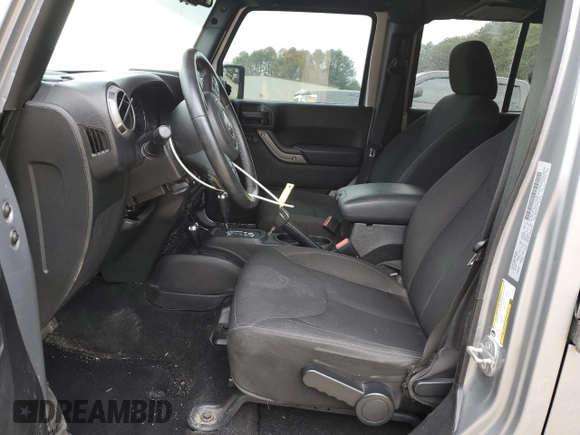 2015 Jeep Wrangler Unlimited Willys Wheeler with VIN 1C4BJWDG4FL723924, listed as a Copart auction lot 47145245 with 166,256 mi miles and Salvage Title. Bid and sale history available at DreamBid. Image 7.