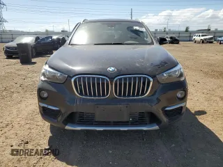 2018 BMW X1 xDrive28i with VIN WBXHT3C38J5K28174, listed as a Copart auction lot 57333385 with 50,064 mi miles and Salvage title. Bid and sale history available at DreamBid. Image 5.