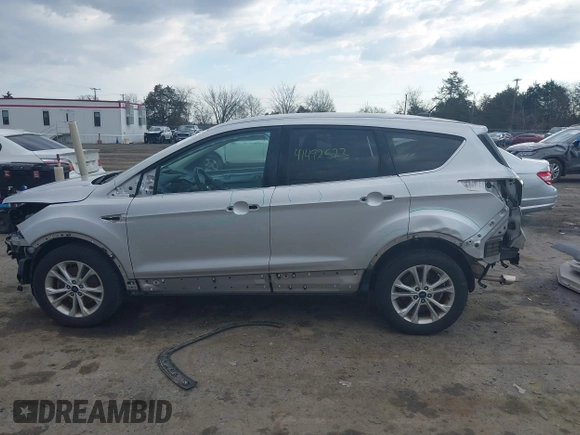 2017 Ford Escape SE z VIN 1FMCU9GDXHUA46689, wystawiony jako IAAI lot #41492523 z przebiegiem 67 401 mil mil oraz . Historia ofert i sprzedaży dostępna na DreamBid. Obrazek 14.