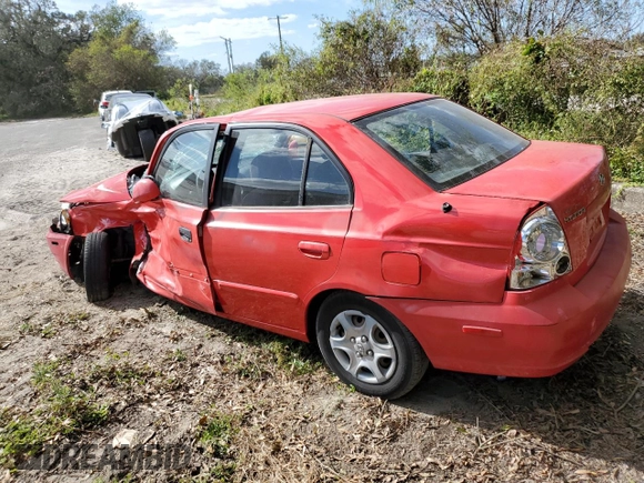 2005 Hyundai Accent GLS with VIN KMHCG45CX5U618473, listed as a Copart auction lot 76752994 with 0 mi miles and Salvage Title. Bid and sale history available at carsss.com. Image 2.