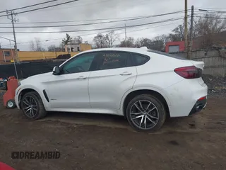 2018 BMW X6 xDrive35i z VIN 5UXKU2C52J0X51312, wystawiony jako IAAI lot #41837606 z przebiegiem 148 722 mil mil oraz . Historia ofert i sprzedaży dostępna na DreamBid. Obrazek 14.