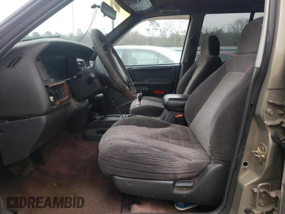 1996 Jeep Grand Cherokee Laredo with VIN 1J4FX58S5TC248122, listed as a Copart auction lot 45843935 with 295,521 mi miles and Salvage Title. Bid and sale history available at carsss.com. Image 7.