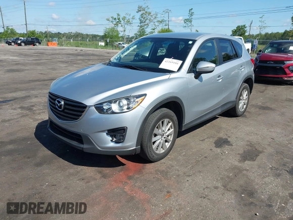 2016 Mazda CX-5 Touring z VIN JM3KE4CY4G0646114, wystawiony jako IAAI lot #42269181 z przebiegiem 58 252 mil mil oraz . Historia ofert i sprzedaży dostępna na DreamBid. Obrazek 18.