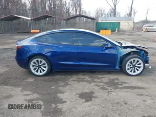 2022 Tesla Model 3 with VIN 5YJ3E1EA7NF188417, listed as a IAAI auction lot 41885623 with 105,457 mi miles and . Bid and sale history available at DreamBid. Image 13.