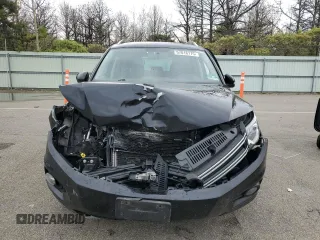 2014 Volkswagen Tiguan S z VIN WVGBV3AX5EW554500, wystawiony jako Copart lot #57016775 z przebiegiem 91 101 mil mil oraz Szkoda całkowita • Salvage title. Historia ofert i sprzedaży dostępna na DreamBid. Obrazek 5.