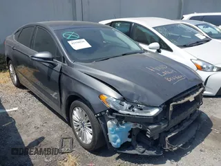 2016 Ford Fusion SE Hybrid z VIN 3FA6P0LU0GR218685, wystawiony jako IAAI lot #42550930 z przebiegiem 178 041 mil mil oraz . Historia ofert i sprzedaży dostępna na DreamBid. Obrazek 1.