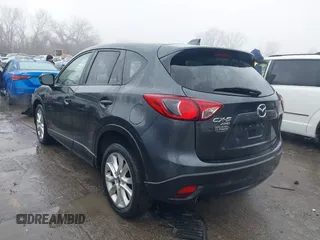 2014 Mazda CX-5 Grand Touring with VIN JM3KE4DY0E0392476, listed as a IAAI auction lot 41419144 with 89,245 mi miles and . Bid and sale history available at carsss.com. Image 3.
