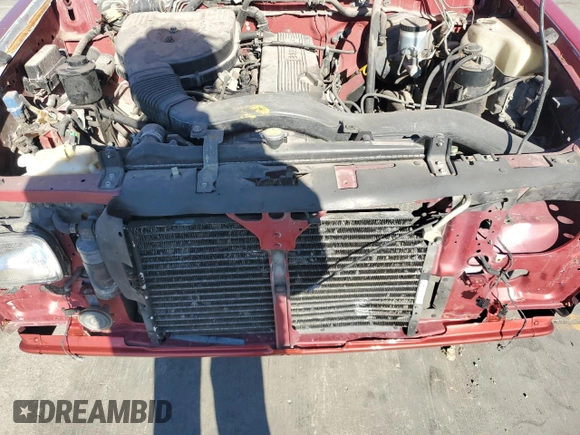 1994 Nissan Frontier XE with VIN 1N6SD16S5RC335548, listed as a Copart auction lot 84459184 with 138,698 mi miles and Salvage title. Bid and sale history available at DreamBid. Image 11.