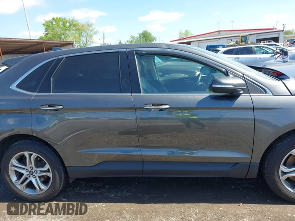 2015 Ford Edge Titanium z VIN 2FMPK4K83FBB30411, wystawiony jako IAAI lot #42230235 z przebiegiem 69 094 mil mil oraz . Historia ofert i sprzedaży dostępna na DreamBid. Obrazek 14.