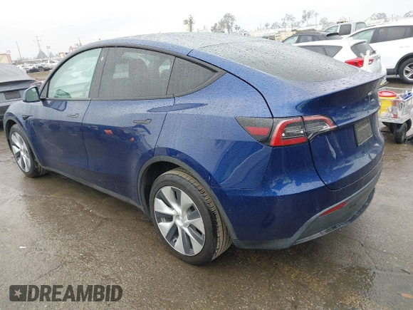 2022 Tesla Model Y Long Range with VIN 7SAYGDEE8NF511395, listed as a IAAI auction lot 41595310 with 65,156 mi miles and . Bid and sale history available at DreamBid. Image 3.