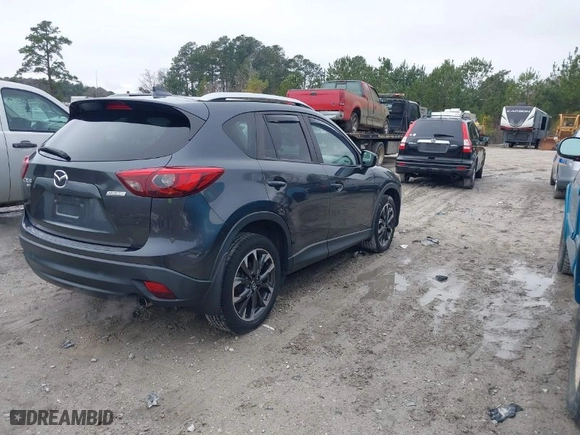 2016 Mazda CX-5 Grand Touring with VIN JM3KE4DY8G0796290, listed as a IAAI auction lot 41619977 with NaN miles. Bid and sale history available at carsss.com. Image 4.