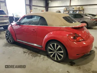 2015 Volkswagen Beetle with VIN 3VW7S7AT1FM822318, listed as a Copart auction lot 71398644 with 73,421 mi miles and Salvage Title. Bid and sale history available at DreamBid. Image 2.