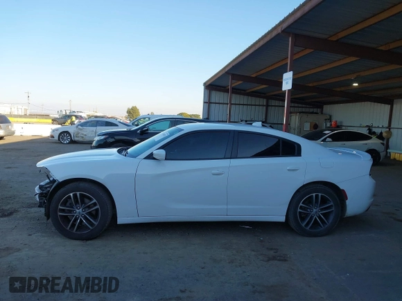 2019 Dodge Charger SXT with VIN 2C3CDXJG1KH533323, listed as a IAAI auction lot 41369282 with 102,467 mi miles and . Bid and sale history available at DreamBid. Image 15.