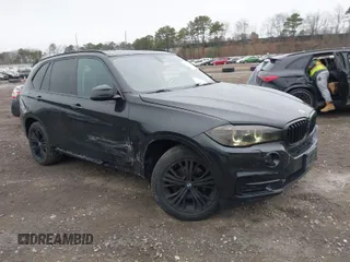 2015 BMW X5 xDrive35i with VIN 5UXKR0C54F0P00889, listed as a IAAI auction lot 42023099 with 196,387 mi miles. Bid and sale history available at carsss.com. Image 1.