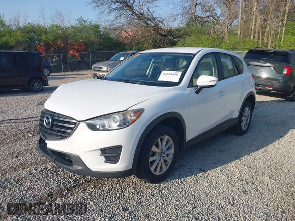 2016 Mazda CX-5 Sport with VIN JM3KE2BY2G0819604, listed as a IAAI auction lot 42059846 with 124,911 mi miles. Bid and sale history available at carsss.com. Image 2.