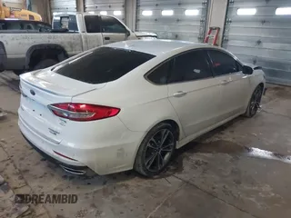 2019 Ford Fusion Titanium with VIN 3FA6P0D92KR153096, listed as a IAAI auction lot 41679393 with 127,292 mi miles and . Bid and sale history available at DreamBid. Image 4.