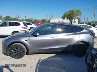 2025 Tesla Model Y Long Range with VIN 7SAYGDED7SA376233, listed as a IAAI auction lot 41777876 with 70 mi miles and . Bid and sale history available at DreamBid. Image 14.