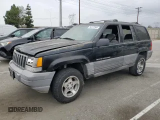 1998 Jeep Grand Cherokee Laredo with VIN 1J4FX58S0WC305329, listed as a Copart auction lot 76777264 with 251,942 mi miles and Clean Title. Bid and sale history available at carsss.com. Image 1.