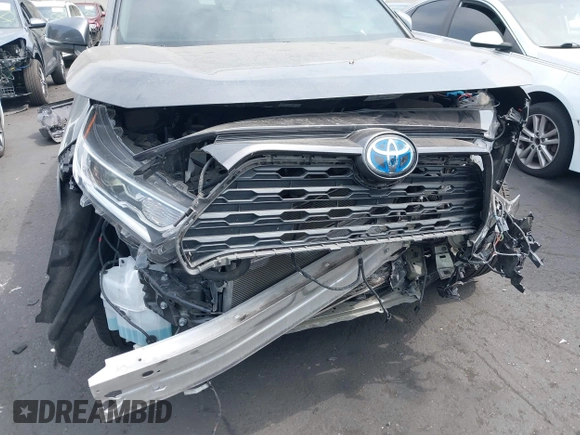 2020 Toyota RAV4 Hybrid XLE with VIN 2T3RWRFV5LW058103, listed as a IAAI auction lot 42665299 with 112,634 mi miles and . Bid and sale history available at DreamBid. Image 18.