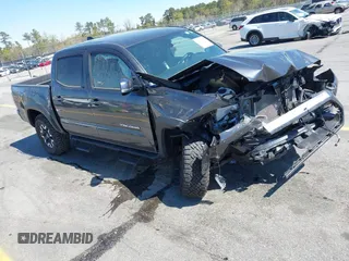 2023 Toyota Tacoma SR z VIN 3TMCZ5AN5PM623387, wystawiony jako IAAI lot #41874879 z przebiegiem 30 083 mil mil oraz . Historia ofert i sprzedaży dostępna na DreamBid. Obrazek 1.
