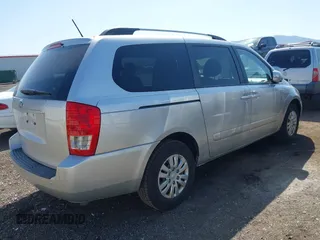 2012 Kia Sedona LX with VIN KNDMG4C70C6491703, listed as a IAAI auction lot 42128411 with 246,586 mi miles. Bid and sale history available at carsss.com. Image 4.