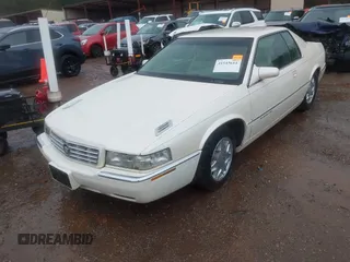 1997 Cadillac Eldorado ESC z VIN 1G6EL12Y6VU614754, wystawiony jako IAAI lot #41543611 z przebiegiem 73 273 mil mil oraz . Historia ofert i sprzedaży dostępna na DreamBid. Obrazek 2.