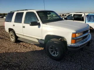 1999 Chevrolet Tahoe Z71 with VIN 1GNEK13R9XJ381424, listed as a Copart auction lot 79940494 with 164,231 mi miles and Salvage Title. Bid and sale history available at carsss.com. Image 4.