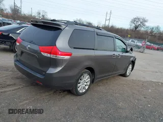 2014 Toyota Sienna LE with VIN 5TDJK3DC1ES087626, listed as a IAAI auction lot 41610813 with 142,311 mi miles and . Bid and sale history available at DreamBid. Image 4.