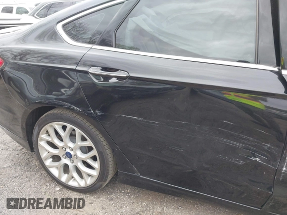 2014 Ford Fusion Titanium with VIN 3FA6P0K92ER355539, listed as a IAAI auction lot 41851471 with 178,176 mi miles and . Bid and sale history available at DreamBid. Image 14.