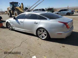 2014 Jaguar XJ Portfolio with VIN SAJWA2GZ2E8V70065, listed as a Copart auction lot 43872505 with 138,677 mi miles and Salvage title. Bid and sale history available at DreamBid. Image 2.