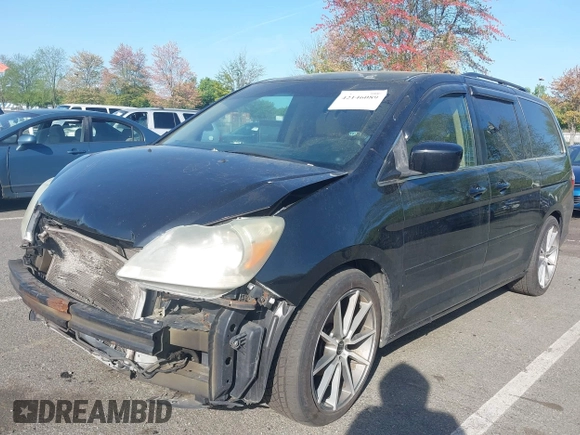 2007 Honda Odyssey EX-L with VIN 5FNRL386X7B128430, listed as a IAAI auction lot 42146089 with 231,059 mi miles and . Bid and sale history available at DreamBid. Image 2.