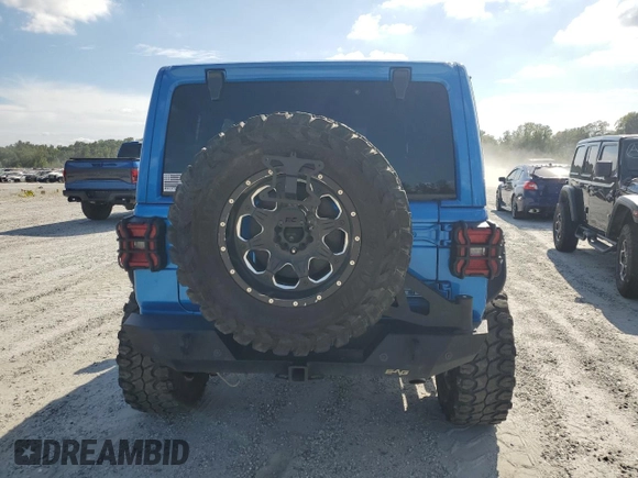 2023 Jeep Wrangler Rubicon with VIN 1C4HJXFN5PW504658, listed as a Copart auction lot 69063484 with 32,490 mi miles and Salvage title. Bid and sale history available at DreamBid. Image 6.