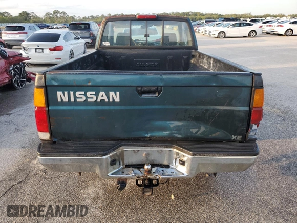 1994 Nissan Frontier XE z VIN 1N6SD16S1RC372743, wystawiony jako Copart lot #54486495 z przebiegiem 206 951 mil mil oraz Szkoda całkowita • Salvage title. Historia ofert i sprzedaży dostępna na DreamBid. Obrazek 6.