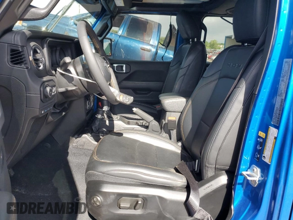 2024 Jeep Wrangler Sahara with VIN 1C4RJXP60RW163829, listed as a Copart auction lot 57182365 with 16,873 mi miles and Salvage title. Bid and sale history available at DreamBid. Image 7.