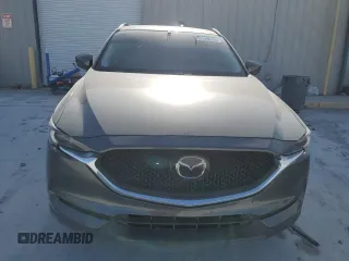2021 Mazda CX-5 Grand Touring with VIN JM3KFBDM0M1464817, listed as a Copart auction lot 48821965 with 53,648 mi miles and Clean Title. Bid and sale history available at carsss.com. Image 5.